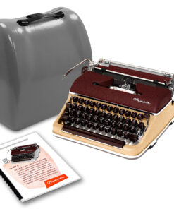Vintage Olympia typewriter with burgundy top and beige body, shown with a gray carrying case and instruction booklet nearby.