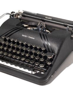 Open black carrying case revealing a vintage Smith-Corona manual typewriter with round keys and metal components visible