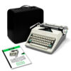 Open-top vintage Olympia typewriter with a black hard case in the background and instruction booklets nearby on a white surface