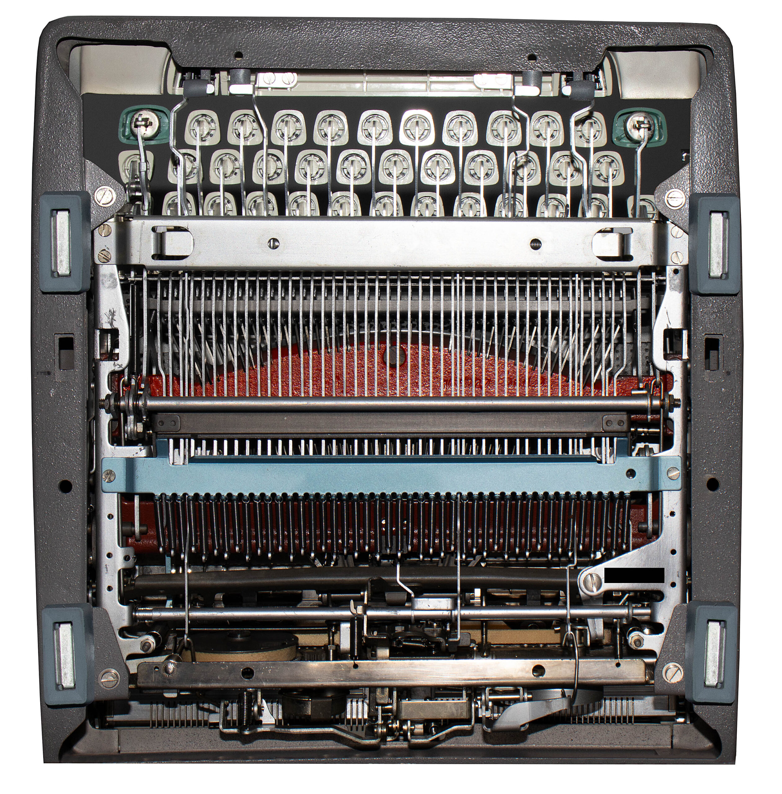 Close-up of a dot-matrix printer head with many pins inside the printer.