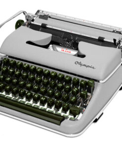 Vintage metal typewriter with green round keys, showing the typing area and ribbon labeled De Luxe.