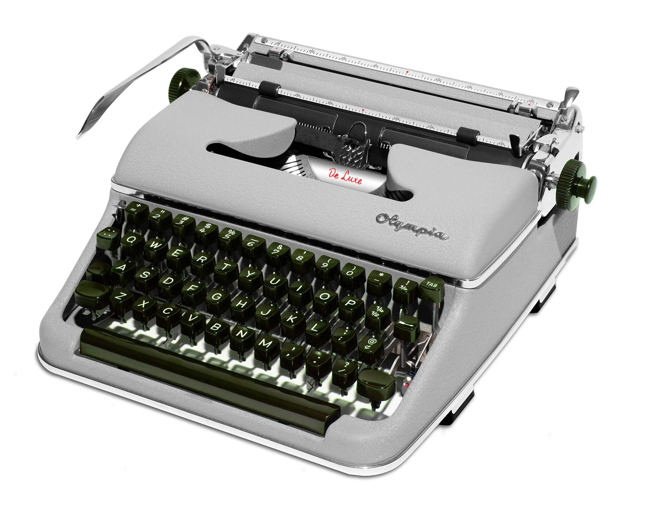 Vintage metal typewriter with green round keys, showing the typing area and ribbon labeled De Luxe.
