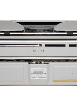 Rear view of a gray vintage Olympia typewriter with exposed type mechanism and a small label on the back plate.