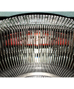 Close-up of a vintage typewriter's metal type bars and slugs arranged in an arc above the platen.