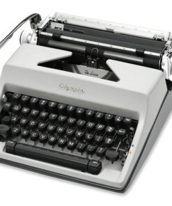 Close-up of an old Olympia De Luxe typewriter, showing the gray body, black keys, and visible carriage with type bars and a silver return lever.