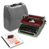 Vintage Olympia typewriter with a red body beside a gray travel suitcase on a white background.