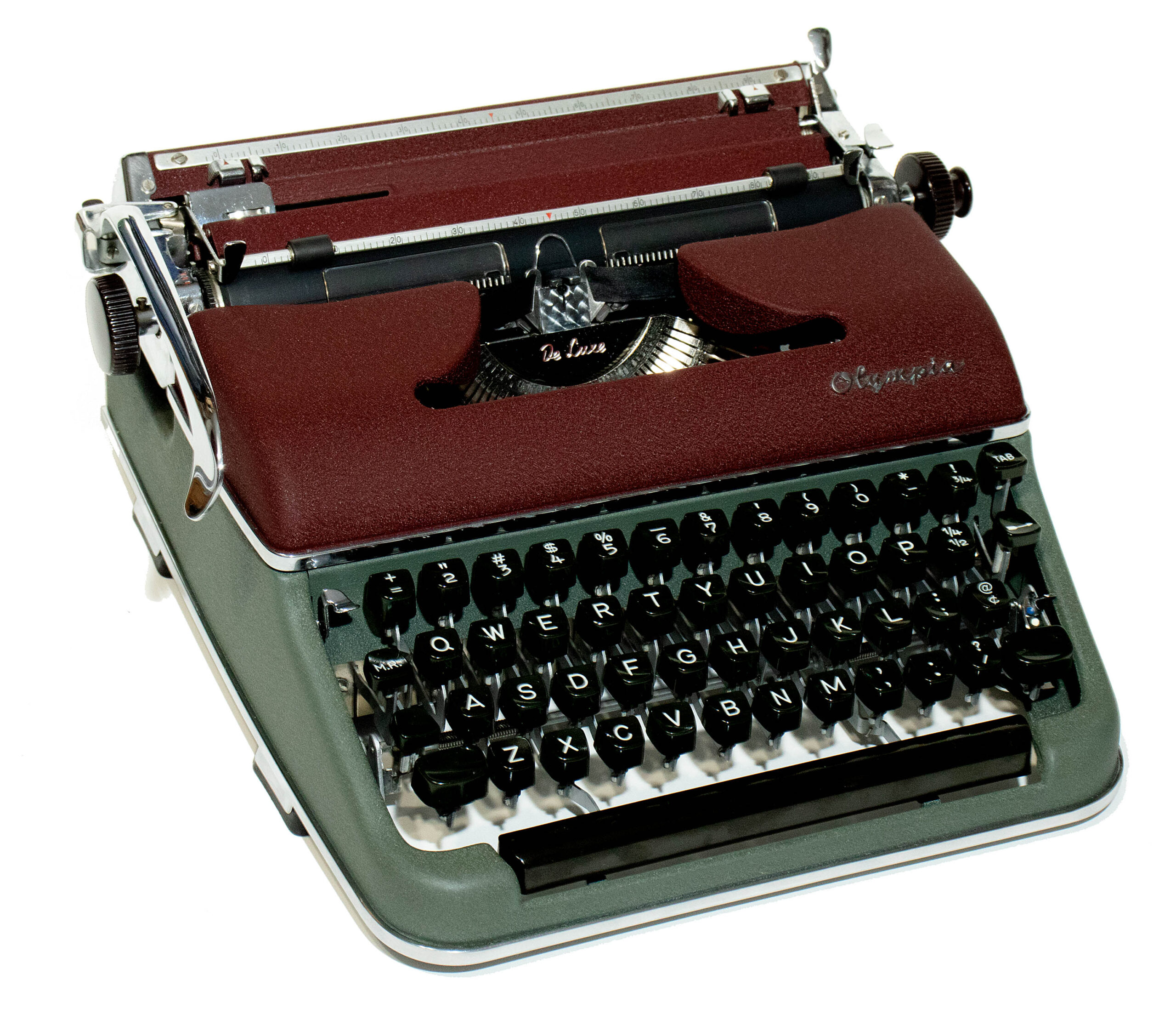 Vintage manual typewriter with burgundy body and black round keys, shown at an angle against a white background.