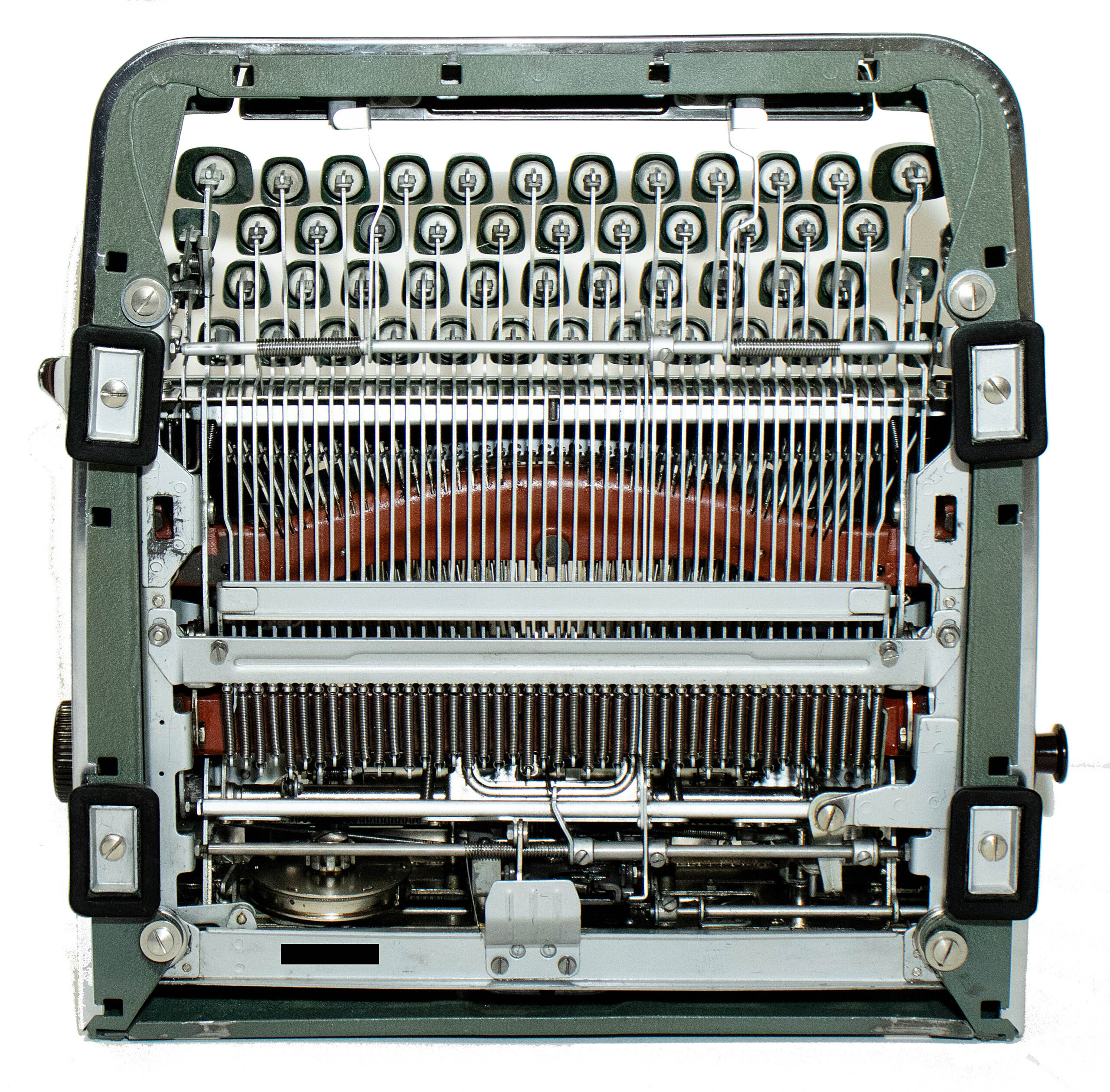 Close-up of a vintage sewing machine interior with many needles and thread guides.