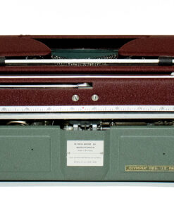 Vintage manual typewriter with brown case and metal carriage, showing a ruler-style front panel and brand plate reading Olympia Werke AG.