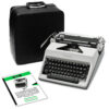 Vintage Olympia typewriter beside a black leather carrying case and instruction booklets.