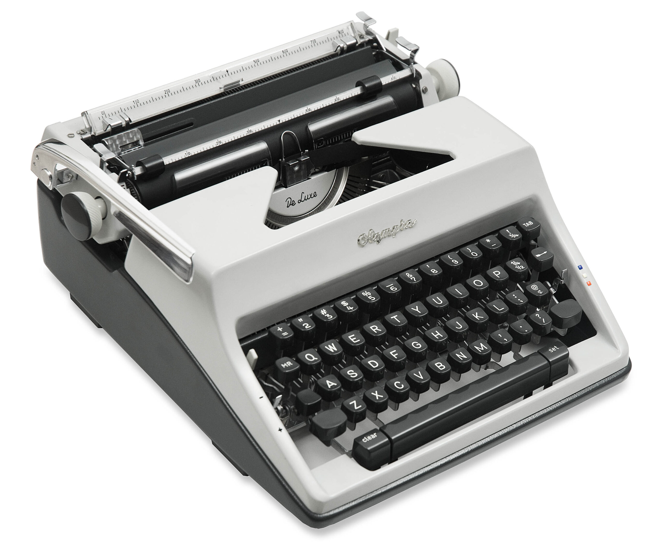 Close-up of a vintage Olympia typewriter showing keys, carriage, and metal typebars.