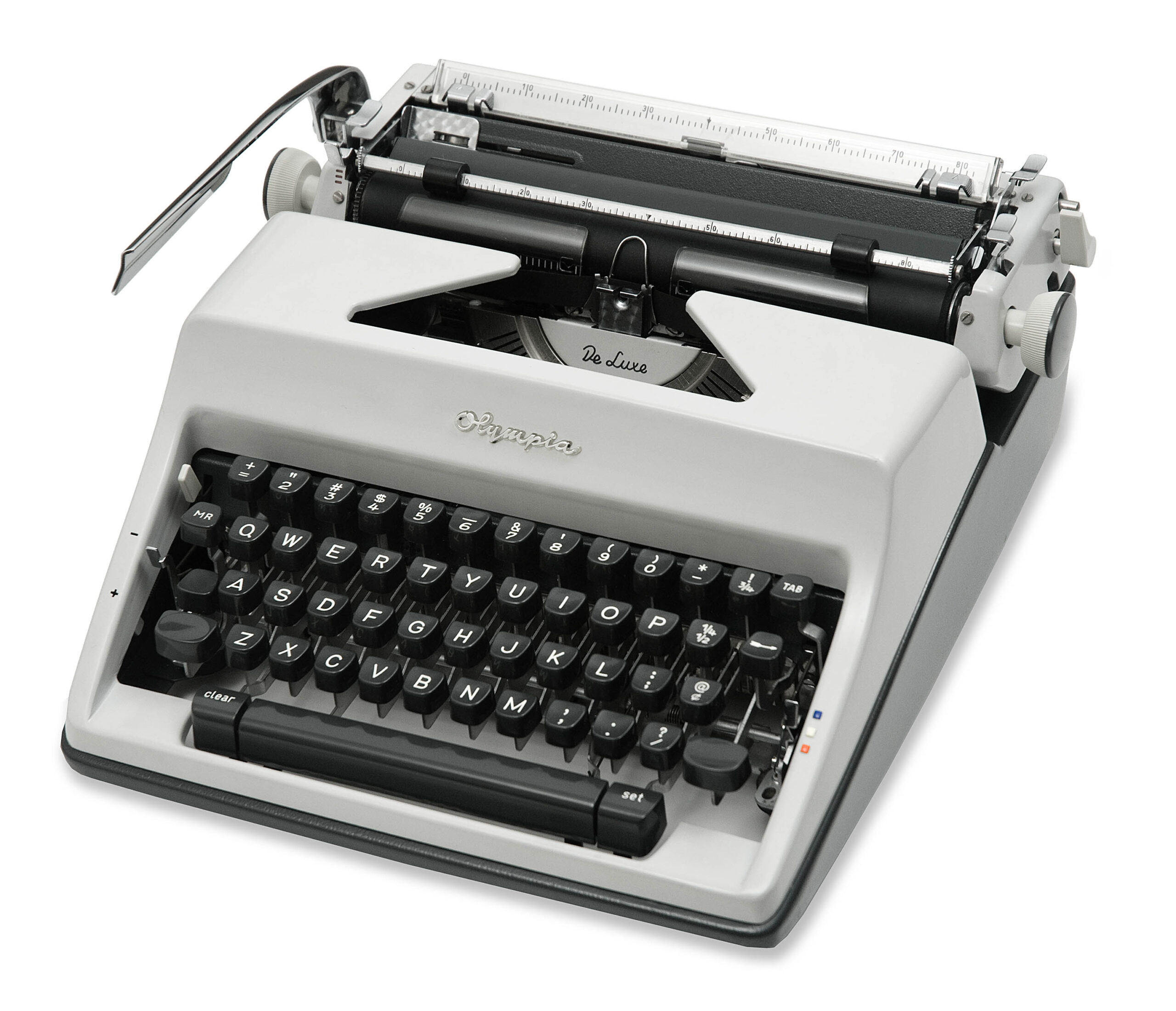 Vintage Olympia typewriter with black keys and silver body, viewed from the front-right.
