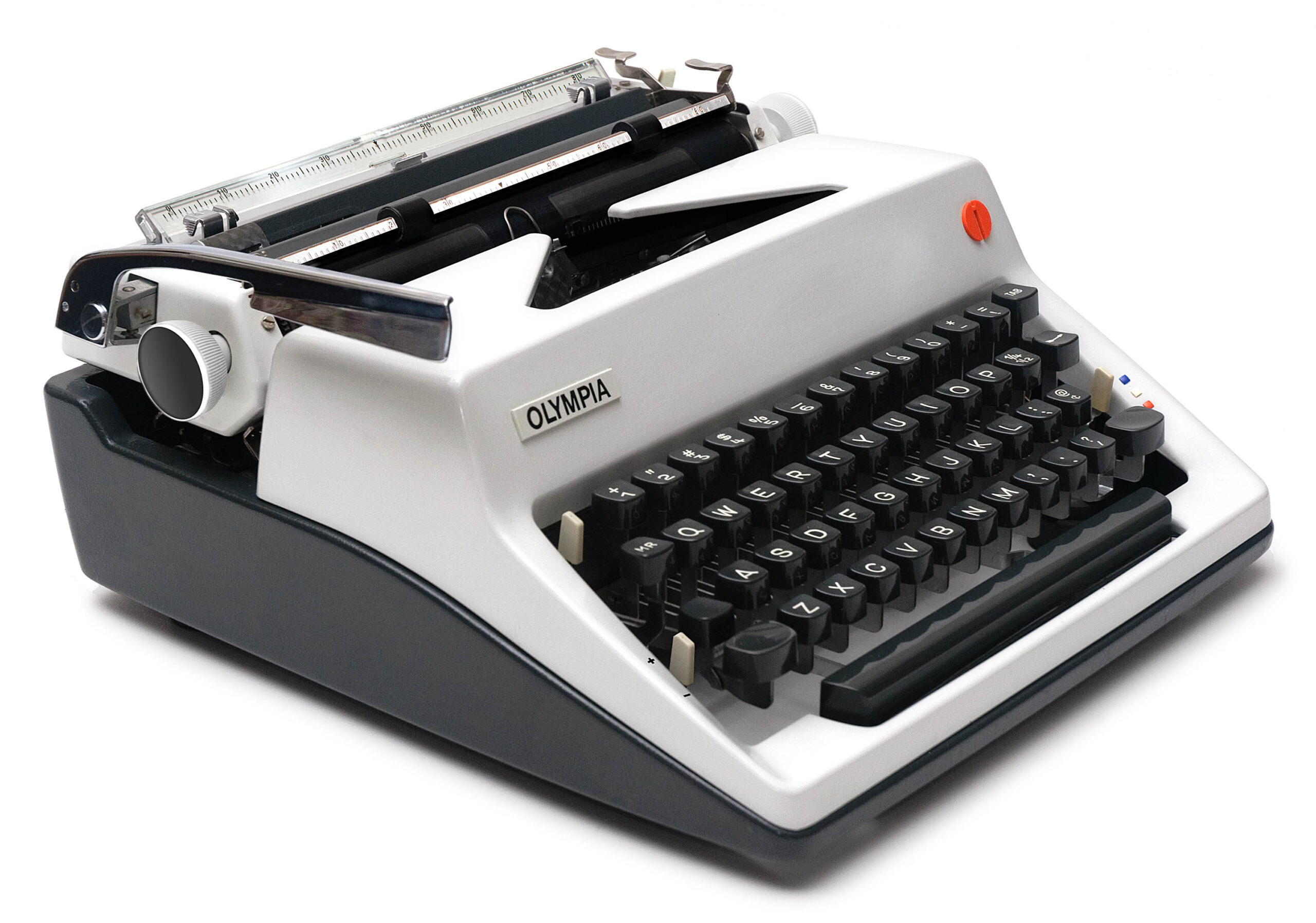 Olympia manual typewriter with black keys on a light gray body, photographed at an angle.