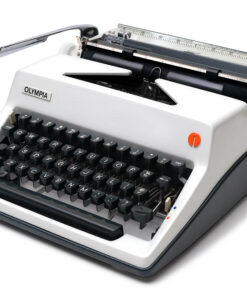 Olympia typewriter with black keyboard keys and silver body, angled view showing type mechanism and carriage rail.
