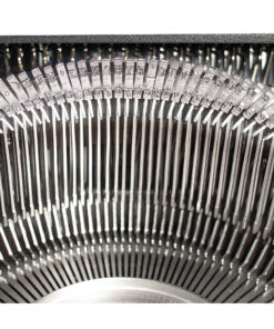 Close-up of a vintage typewriter's typebars fanning out in a circle.