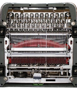 Close-up of the internal typewriter mechanism showing type hammers, typebars, and red ribbon.
