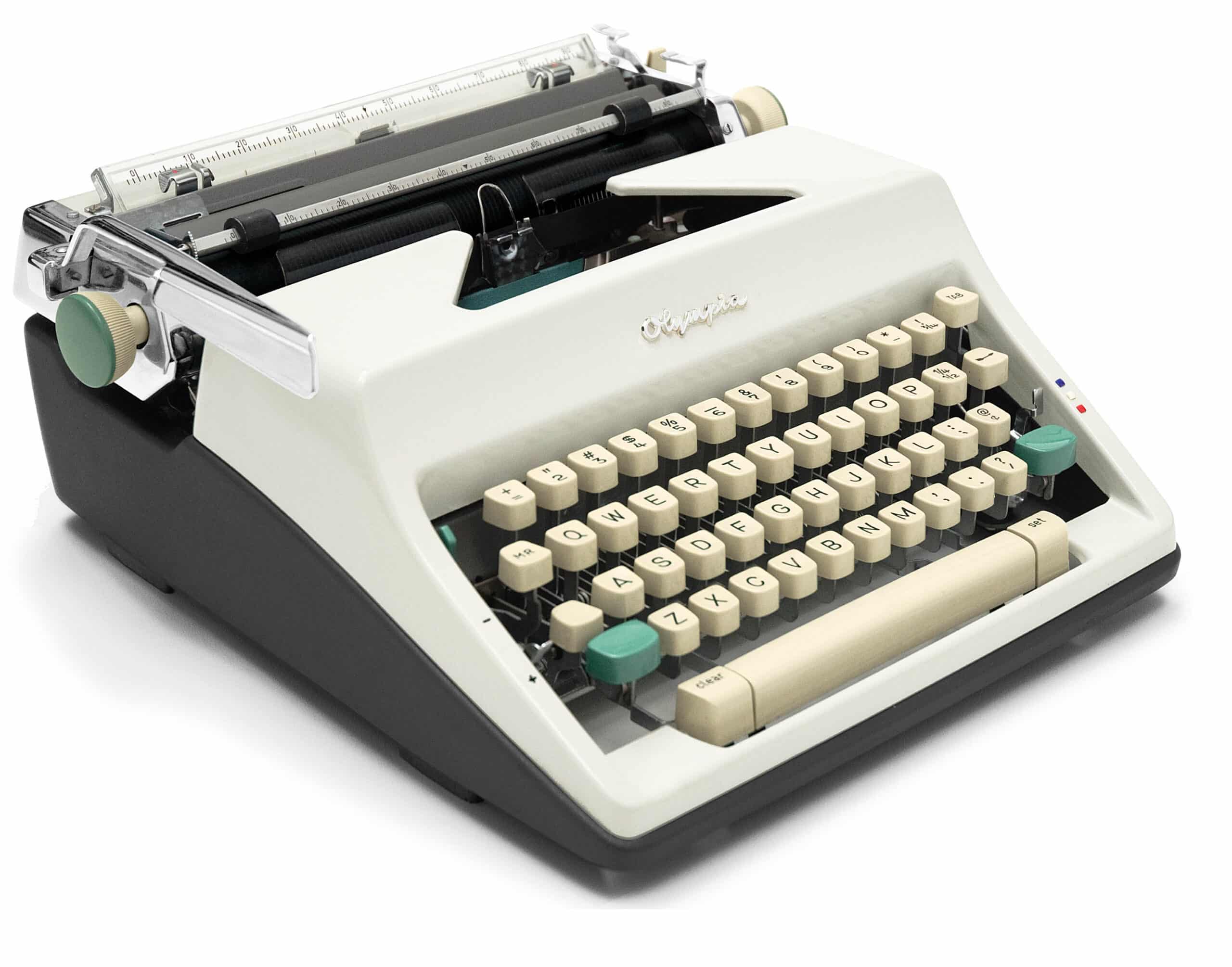 Vintage Olympia mechanical typewriter with cream keys, photographed from the side.
