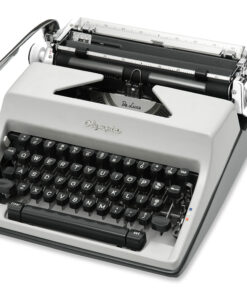 Close-up of a vintage portable typewriter showing its keyboard and exposed type mechanism, gray body with black keys and metal components.