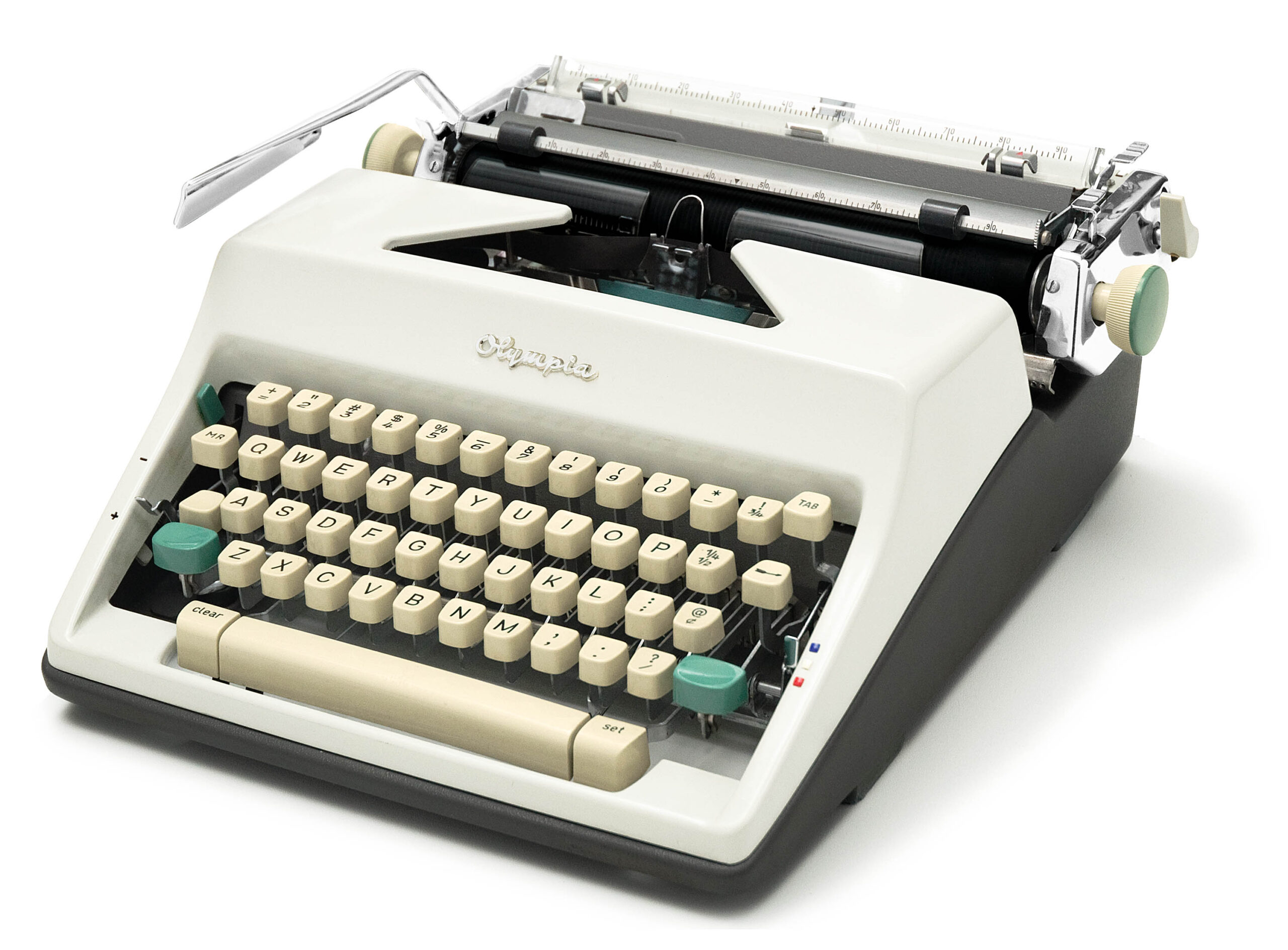 Vintage Olympia typewriter with cream keys and green accents, shown from a slightly angled top view.