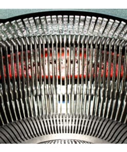 Close-up of a vintage typewriter's metal type hammers in a curved arc with a red ink ribbon visible behind them, suggesting the printing mechanism.