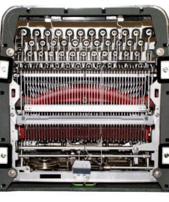 Interior of a vintage mechanical typewriter showing type hammers, type bars, and a red ink ribbon underneath the keyboard area.