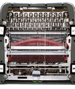 Close-up of a vintage typewriter's inner typing mechanism, showing type hammers, typebars, and ribbon frame.