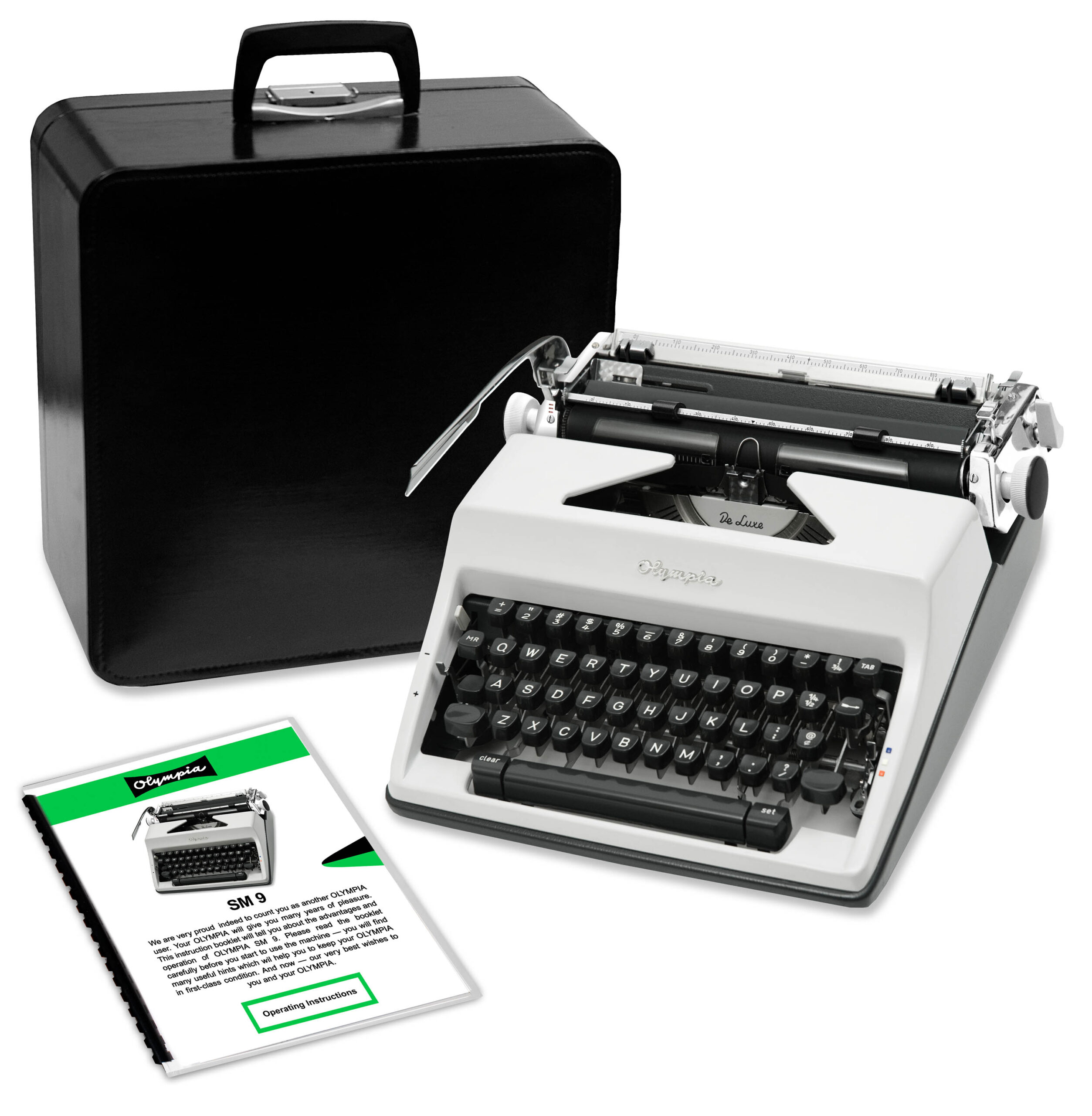 Vintage Olympia typewriter with a black carrying case and instruction manuals nearby.