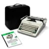 Vintage Olympia typewriter with a black carrying case, keys exposed and paper guides nearby.