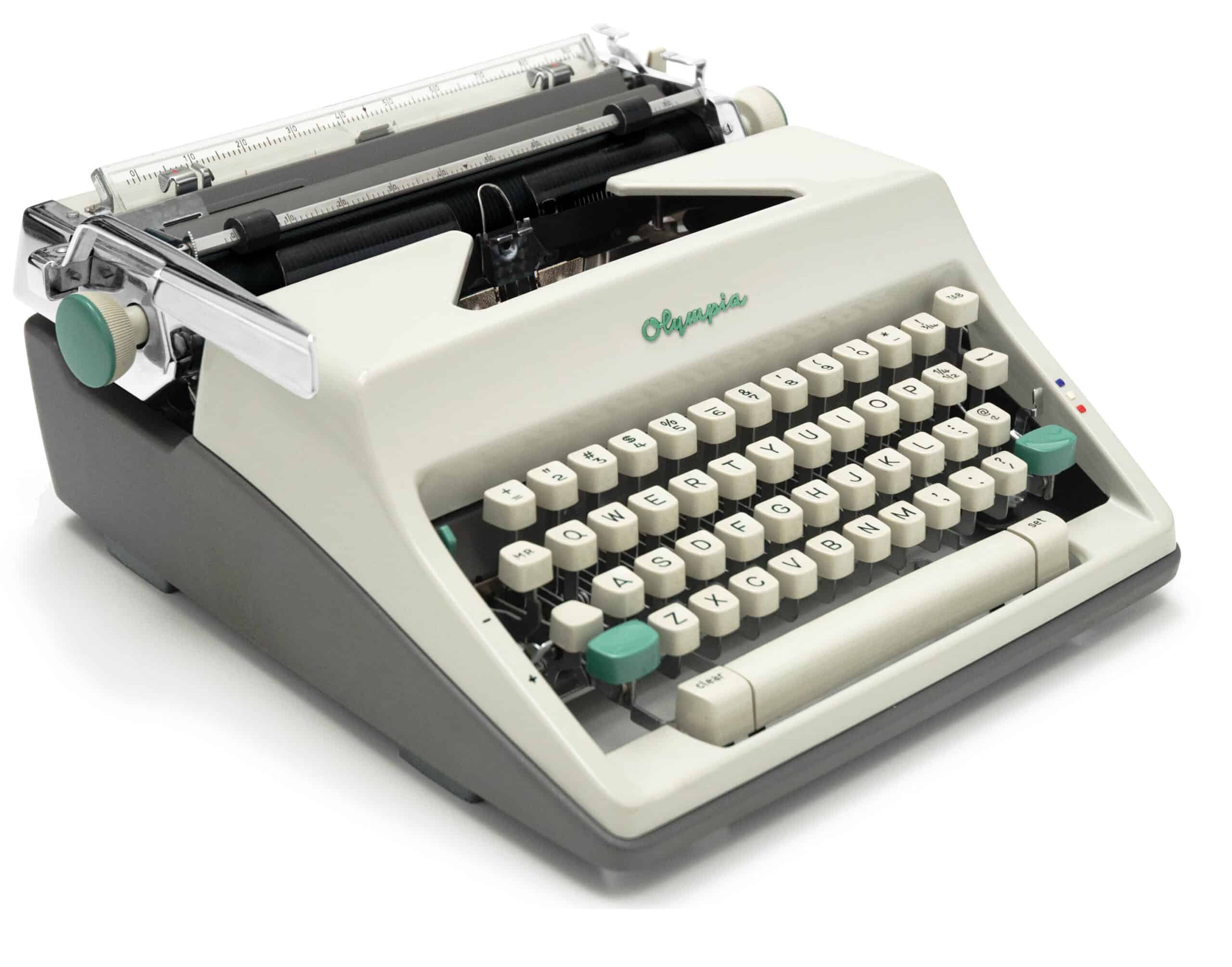 Vintage Olympia typewriter with a cream body and beige keys on a white background
