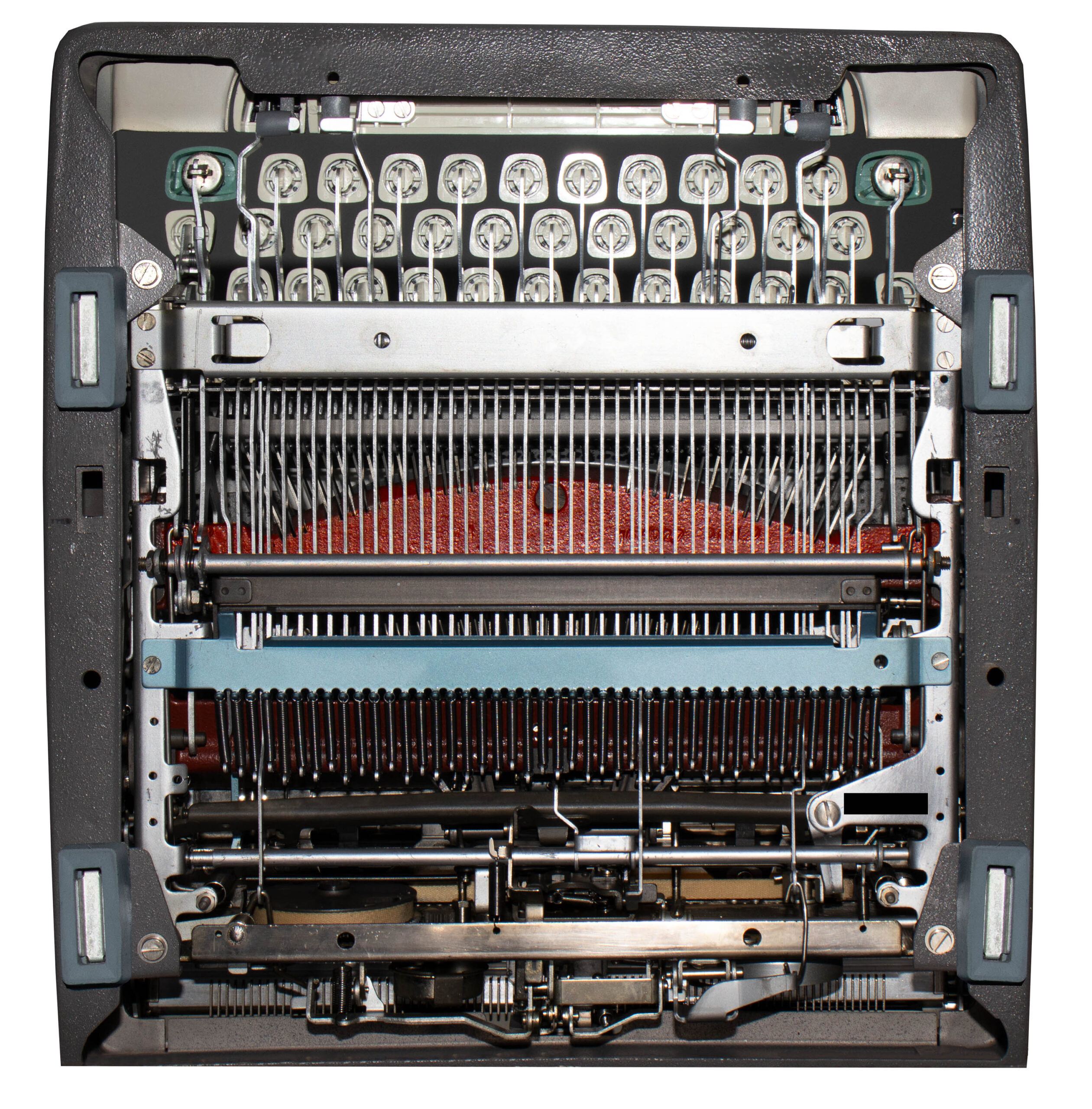 Internal view of a vintage typewriter with exposed typebars and hammers, showing the key wiring and ribbon area beneath.