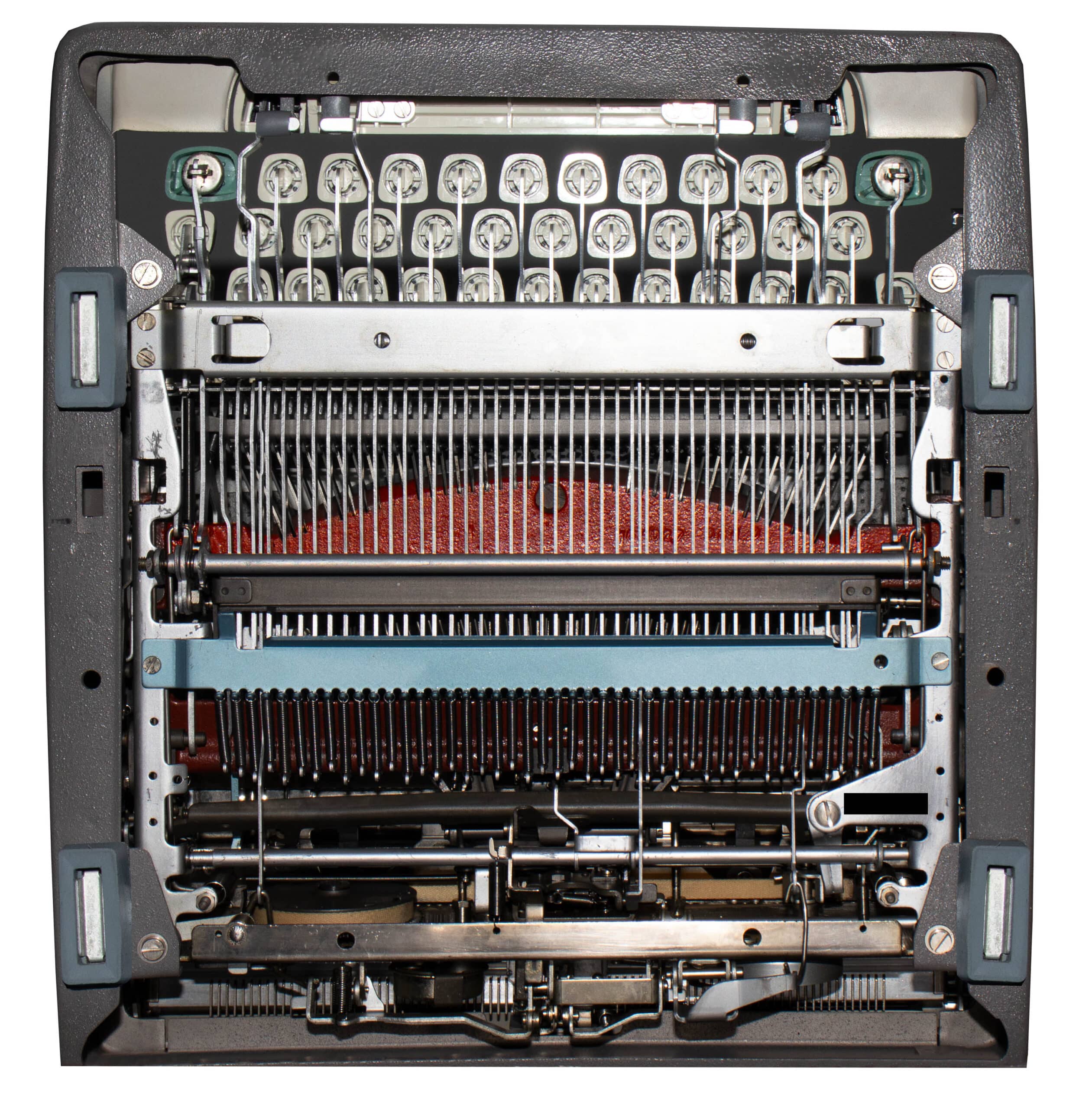 Close-up of a printer's internal print head area showing many vertical metal pins and supporting parts.
