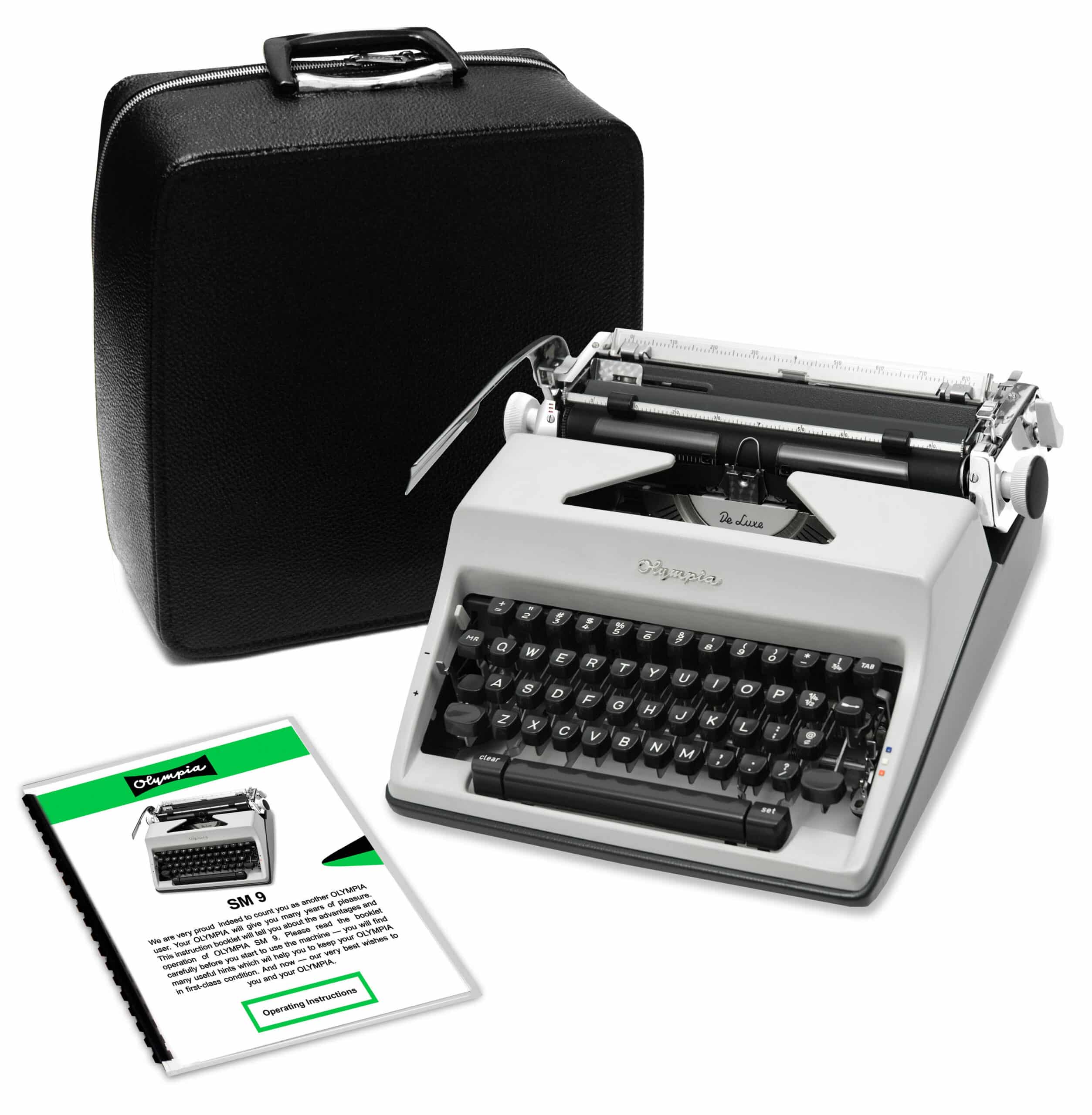 Vintage Olympia manual typewriter with a black carrying case and operating instructions booklet nearby.